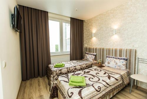 Ένα ή περισσότερα κρεβάτια σε δωμάτιο στο Sokol-Hotel