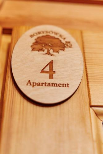 a wooden plaque with the number four on it at BORYSÓWKA in Kopanica