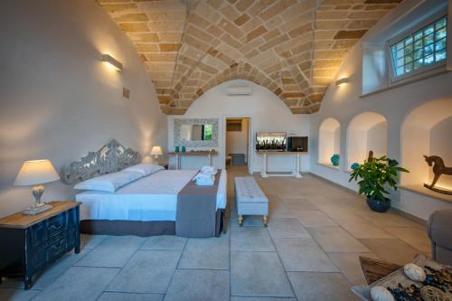 Postel nebo postele na pokoji v ubytování b&b Casale Vecchio Lecce