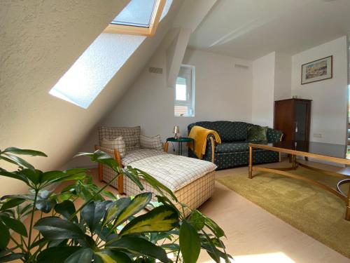 a living room with a bed and a couch at Wanderlust in Bisingen