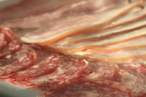 a close up of a pile of meat with a fork at B&B Atuatuca in Tongeren