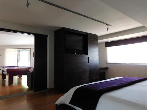 Postel nebo postele na pokoji v ubytování Hotel & Spa Luna Canela Boutique