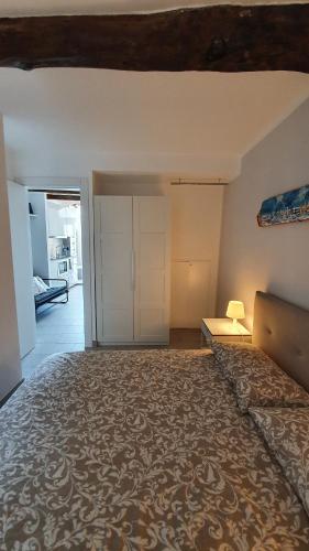an empty room with a bed and a closet at Best flat beachfront Camogli in Camogli