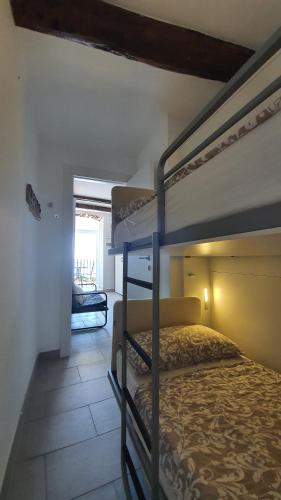 a bedroom with two bunk beds and a hallway at Best flat beachfront Camogli in Camogli