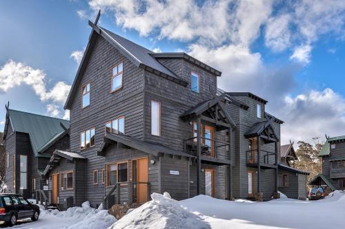 a large wooden house in the snow at Zoncolan in Dinner Plain