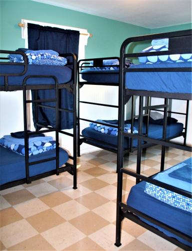 a group of bunk beds in a room at HI Point Montara Lighthouse in Montara