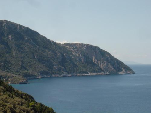 a view of a large body of water between two mountains at Astir Hotel in Karlovasi