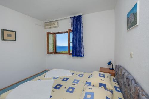 Posteľ alebo postele v izbe v ubytovaní Apartments Dragana
