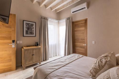 Postel nebo postele na pokoji v ubytování Casa Quebrada Hotel Boutique