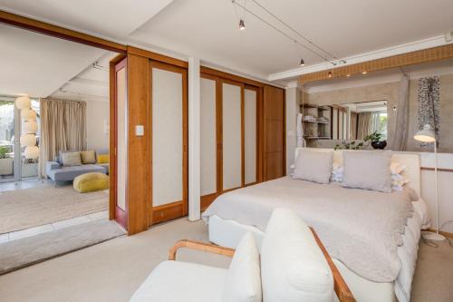a bedroom with a bed and a living room at Wixy in Cape Town