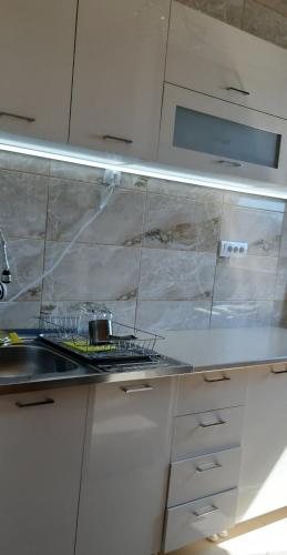 Η κουζίνα ή μικρή κουζίνα στο Lux apartman