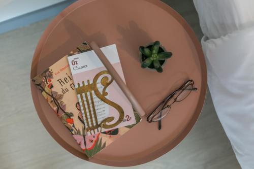 a cake with a book and glasses on a table at WS Tour Eiffel - Nicolo in Paris