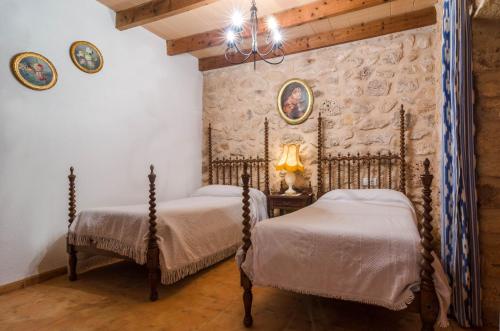 A bed or beds in a room at Can Gallot De Punxuat