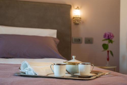 Le Ferrerie agriturismo fattoria Marchesiniにあるベッド
