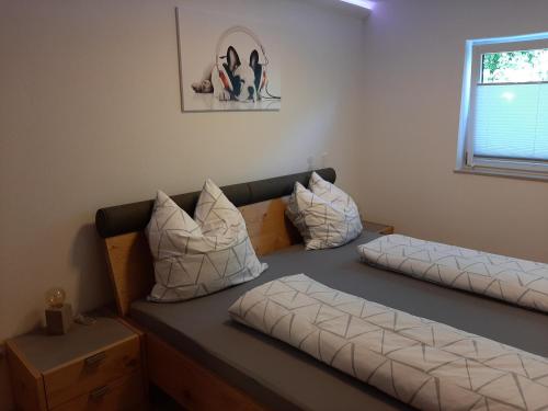 a room with a couch and pillows on it at Ferienwohnung Jurastein in Burglengenfeld