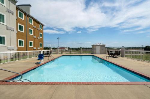 a large swimming pool on a balcony of a building at Wingate by Wyndham Horn Lake Southaven in Horn Lake