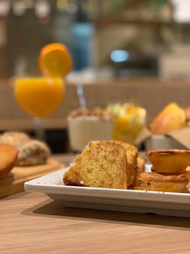 a plate of bread and toast on a table at Spot Apartments in Porto