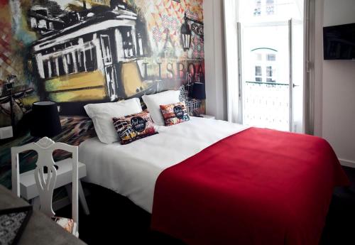 a bedroom with a large bed with a painting on the wall at The ART INN Lisbon in Lisbon