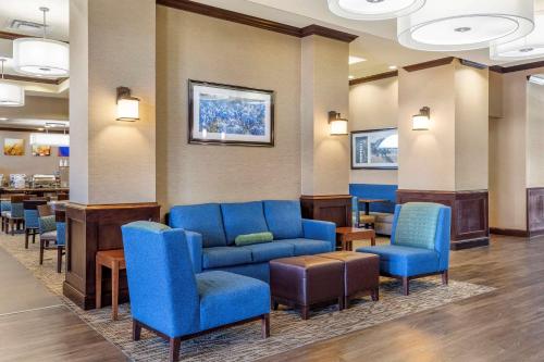 a living room filled with couches and chairs at Comfort Suites Frisco in Frisco