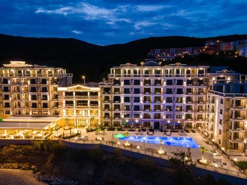a view of a hotel at night at Onyx Beach Residence - Free Parking & Beach Access in Sveti Vlas