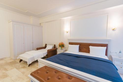Postel nebo postele na pokoji v ubytování Grand Hotel Palladium