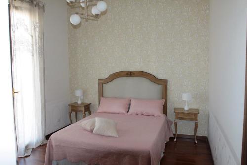 Postel nebo postele na pokoji v ubytování Casa Parthenope