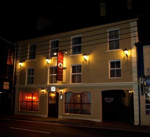 a building on a street at night at Atlantic Guest House in Donegal