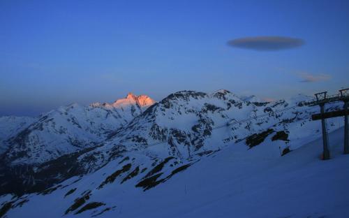 a snow covered mountain with a ski lift at Pension Trojerhof in Heiligenblut
