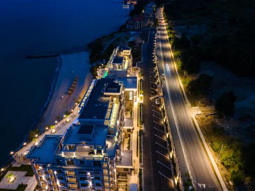an overhead view of a beach at night at Onyx Beach Residence - Free Parking & Beach Access in Sveti Vlas