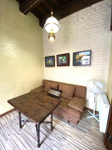 a living room with a couch and a table at Квартира подобово на Площі Ринок 39 in Lviv