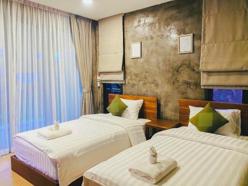 En eller flere senger på et rom på Pai Nam Now