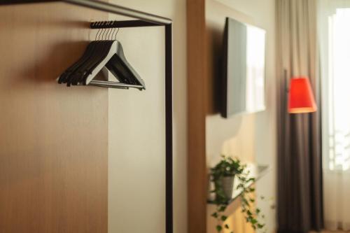 a close up of a mirror in a room at Holiday Inn - the niu, Sparrow Regensburg by IHG in Regensburg