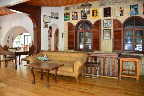 a living room with a couch and a table at Aquarius Hotel in Side