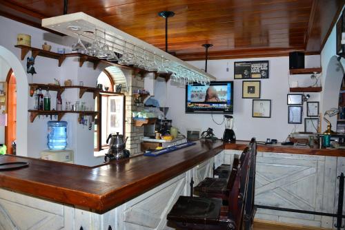 a bar with a wooden counter in a room at Aquarius Hotel in Side