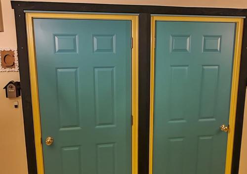 two doors are shown next to each other at Bluebird Hotel in Fujikawaguchiko