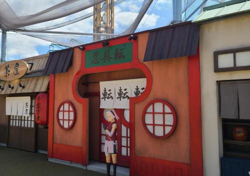 a building with a painting on the side of it at Bluebird Hotel in Fujikawaguchiko