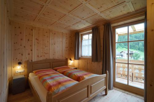 מיטה או מיטות בחדר ב-Unterhabererhof