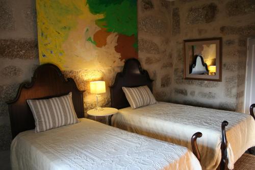 Postel nebo postele na pokoji v ubytování Cazal Da Lamella