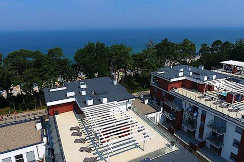 an overhead view of a building next to the ocean at REWAL Komfortowy apartament przy plaży typu STUDIO in Rewal