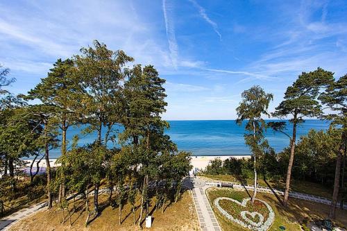 a view of the ocean with a heart painted on it at REWAL Komfortowy apartament przy plaży typu STUDIO in Rewal