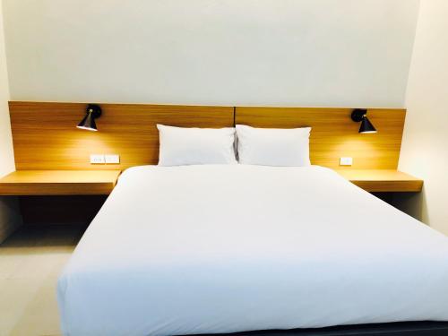 Un ou plusieurs lits dans un hébergement de l'établissement ARENICE Boutique Hotel