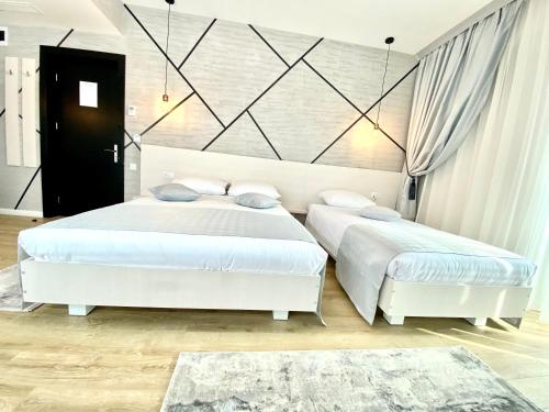 Postel nebo postele na pokoji v ubytování Hotel Bulevard