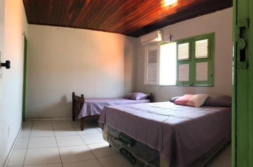 Postel nebo postele na pokoji v ubytování Casa praia Peito de Moça Luís Correia