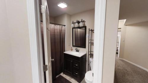 a bathroom with a sink and a mirror at The Maples - Hot tub! Amazing views, pets welcomed in Ellicottville