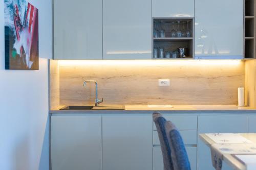 a kitchen with a sink and a counter at Villa Lungomare in Malinska