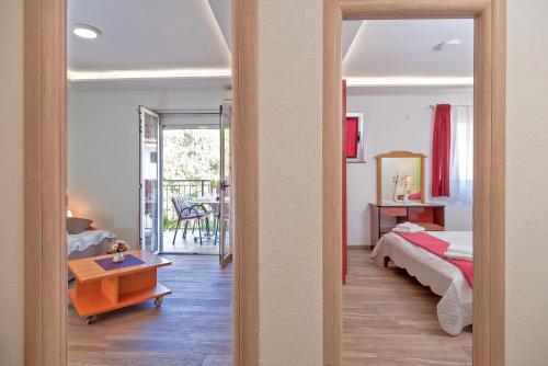Postel nebo postele na pokoji v ubytování Apartmani Putnik