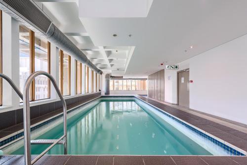 a swimming pool in a building at #1205 Cartwright - Wild Radiance in Cape Town