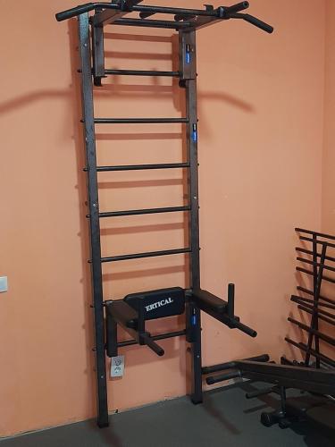 a gym shelf with a treadmill in a room at Hotel Pivdennyi in Oleksandriya