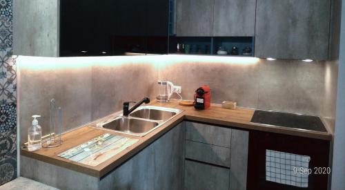 a kitchen with a sink and a counter top at Welcome Beach Apartment in Hamallë