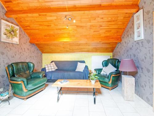 a living room with a couch and two chairs at Enjoy a relaxing break for two and discover Durbuy in Biron